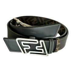 Expertly crafted in Italy, the Fendi Faster Belt features a silver buckle closure and is reversible, giving you versatility and style. This 1.3 inch brown and asphalt belt exudes luxury and authenticity, ensuring a statement-making addition to any outfit. Size 100. Silver FF logo buckle closure Reversible Made in Italy Size: 100/44 Comes with Fendi Box and Fendi dustbag Made in: Made in Italy Width: 1.6 Inch Color: Black and Asphalt grey (double sided) Material: Leather Model 7C0486 Size: one si Versus Versace, Fastest Man, Ff Logo, Brown Belt, Branded Handbags, Sport Watches, Mens Big And Tall, Belt Size, Mens Belts