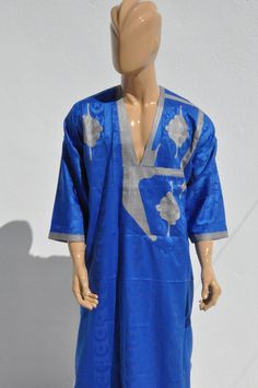 Moroccan kAFTAN for men, oriental kaftan, All sizes are Available Beautiful Moroccan kaftan in cotton for men. This Moroccan clothing is handmade in soft fabric cotton. This kaftan is very pleasant to wear mainly in summer, at the beach, after a spa, indoor, outdoor, at a party... Very fast to wear, not stick to the skin, this kaftan is a really must have clothing. - Cotton - embroidery - Machine washing return policy I check myself each product and sell only the best quality products in any cas Ceremonial Long Sleeve Agbada For Festivals, Traditional Agbada Tunic For Eid, Blue Traditional Thobe For Ceremonies, Blue Traditional Ceremonial Kaftan, Blue Kaftan For Eid, Traditional Blue Thobe For Ceremonies, Blue Kaftan For Eid And Traditional Ceremonies, Long Sleeve Thobe With Traditional Patterns For Festivals, Traditional Eid Agbada Tunic