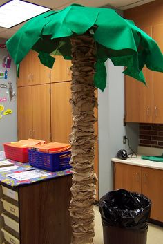 a palm tree made out of paper in an office