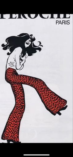 a woman in red and black patterned pants with her hair blowing back to the side