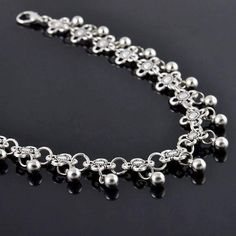 A classic silver chain ankle bracelet with tiny silver beads in the tradition of India and Eastern Asia. Traditionally worn by brides and belly dancers, this exotic but feminine bracelet is just the accessory for a summer look. Light and airy with delicate movement of the beads, its a perfect accessory for your beach ensemble! Can be worn loose as a bracelet or fit larger wrists Anklet for Women foot wear Occasion: Everyday wear, Beach Wear, Special Events, Bridal Accessory, Belly dancer accesso Anklet Jewellery Sterling Silver, Bohemian Silver Beaded Anklets, Silver Beaded Festival Anklets, Silver Dangle Metal Anklets, Silver Beaded Anklets For Festival, Festival Silver Beaded Anklets, Silver Dangle Anklets, Silver Metal Beaded Anklets, Elegant Beaded Metal Anklet