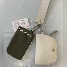 Lululemon Dual Pouch Wristlet Bag New With Tags Color: Grey Sage/White Opal Ready To Go With The Flick Of A Wristlet. This Wristlet Comes With Two Zippered Pouches To Keep Small Items In Place While You're On The Move. Detachable Pouches Let You Customize The Hook And Function Use Pouch As Standalone Wallet Pouch Dimensions: 11.5cm X0.5cm X 7cm (4.5" X 0.2"X2.8")I Functional White Travel Pouch, Everyday White Pouch With Removable Section, White Pouch With Removable Section, White Zipper Closure Pouch For On-the-go, White Removable Pouch For Everyday Use, Versatile White Bag With Zipper Pouch, Functional White Pouch For Daily Use, Everyday White Mobile Phone Pouch, Versatile White Pouch For Everyday