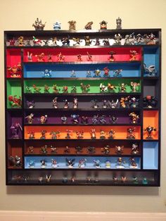 a colorful shelf filled with lots of toy figurines