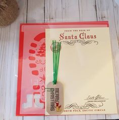 a santa claus themed stationery is displayed on a table