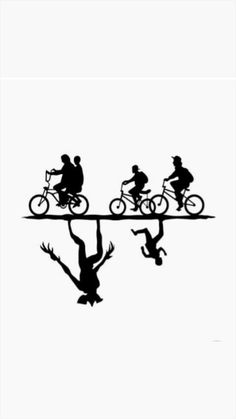 three people riding bikes on a long line with birds flying above the bike path,