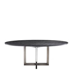 an oval table with metal legs and a black marble top, against a white background