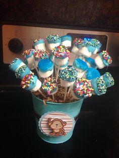 a cup filled with cake pops and marshmallows