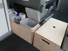 the inside of an airplane with two drawers and one sink in it's compartment