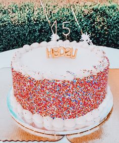 a red and white cake sitting on top of a table