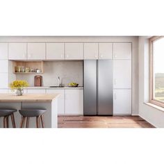 an image of a kitchen setting with white cabinets and stainless steel refrigerator freezer combo