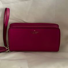 Removable Wrist Strap. One Slip Pocket On Backside. 18 Card Slots, 3 Bill Compartments And A Zippered Pocket For Change. 2 Separate Zippered Compartments. Formal Kate Spade Clutch, Kate Spade Wallet, Kate Spade Bags, Kate Spade Bag, Pink Leather, Wrist Strap, Card Slots, Slots, Kate Spade