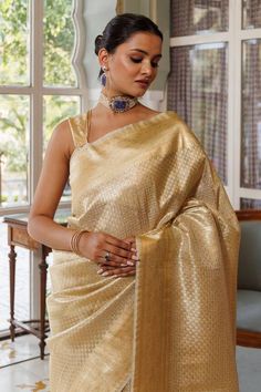 Gold banarasi silk saree with zari woven bloom motifs all over. Comes with an unstitched blouse piece. - Aza Fashions Festive Banarasi Silk Pre-draped Saree With Self Design, Gold Chanderi Blouse For Transitional Seasons, Transitional Gold Chanderi Blouse, Gold Dupatta Blouse For Festive Occasions, Festive Gold Blouse With Dupatta, Elegant Festive Blouse Piece For Navratri, Unstitched Gold Blouse With Dupatta, Gold Slub Silk Saree Set, Gold Blouse With Dupatta, Unstitched