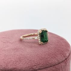 This ring features a beautiful emerald set in a halo ring setting with sparkling natural diamonds all set in 14k solid yellow gold. This design features two tapered baguette diamond accents in the shank. A gorgeous modern look that's perfectly balanced between minimalist and glamour. Halo Ring Setting, Emerald Set, Designer Silver Jewellery, Jewelry Showcases, Ring Setting, Halo Ring, Baguette Diamond, Earring Findings, Pendant Bracelet