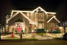 a house covered in christmas lights and decorations