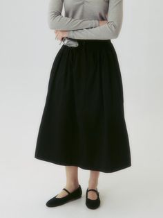 This product is a Button Flared Skirt, designed with a graceful flared silhouette that adds a touch of elegance and movement to the overall look. Its high-waist style accentuates the waistline, while the button details provide a classic and refined touch. This versatile skirt is suitable for both formal and casual settings, offering endless styling possibilities. - The skirt features a flared design that creates a sophisticated and feminine silhouette.- A series of buttons along the front add a vintage charm and visual interest.- Made from a smooth fabric, the skirt ensures comfort and a fluid drape.- Its versatile style pairs well with both fitted tops for a polished look and casual tees for a more relaxed outfit. Chic A-line Skirt With Button Closure, Chic A-line Skirt With Buttons, Flared Workwear Skirt With Buttons, Buttoned Flared Skirt For Work, Flared Buttoned Skirt For Workwear, Workwear Flared Skirt With Buttons, Button Closure Maxi Skirt For Work, Elegant Black Skirt With Button Closure, Flared Workwear Skirt With Button Closure