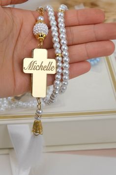 "Show your gratitude to your baptism guests with these personalized rosary favors. They are made with different colors and comes in sachet. The cross have the name and date of the baptism for a personal touch. Our rosaries are suitable for any religious occasion, such as baptism, christening, bautizo, first communion or confirmation. -This is a lovely souvenir that features glass pearl rosary beads with the baby's name and baptism date on a cross. It is a token of your special day that the baby White Spiritual Rosary For Mother's Day, Mother's Day White Spiritual Rosary, Spiritual White Rosary For Mother's Day, Personalized White Rosary For Confirmation, Personalized Cross Rosary Bracelet For Baptism, White Rosary For Mother's Day Gift, Personalized White Cross Rosary Bracelet, Personalized Spiritual Rosary Gift, Spiritual 8mm Beads Rosary For Baptism