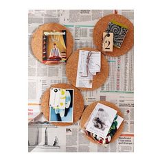 three cork coasters with pictures and photos on them sitting on top of a newspaper