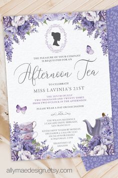 a purple and white tea party with flowers on the front, butterflies in the background