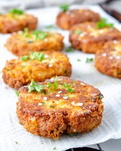 crab cakes with parsley on top are ready to be served in the oven or grill