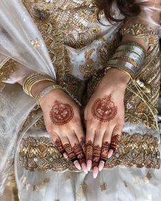 a woman with henna on her hands