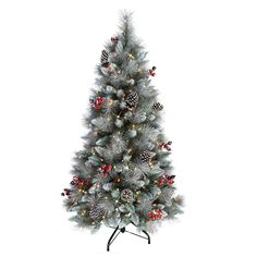 a silver christmas tree with pine cones and red berries on the top is shown in front of a white background