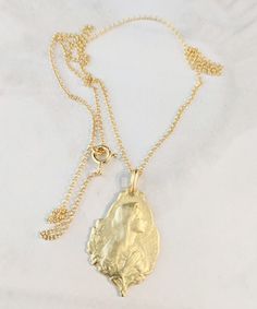 This vintage French medal of the Blessed Virgin Mary has been recast in sterling silver and plated in 18K gold. It hangs on an 18 inch Italian 18K gold vermeil chain. The Blessed Virgin Mary was a friend of her son Jesus' friend, Mary Magdalene. They were together at the foot of the cross with John the beloved when the other apostles fled. Antique Gold Medallion Necklace For Gift, Hammered Yellow Gold Medallion Necklace As A Gift, Hammered Yellow Gold Medallion Necklace Gift, Vintage Yellow Gold Tarnish Resistant Medallion Necklace, Vintage Yellow Gold Tarnish-resistant Medallion Necklace, Elegant Coin Pendant Necklaces For Commemoration, Vintage Gold Medallion Necklace In Sterling Silver, Antique Sterling Silver Gold Coin Necklace, Antique Gold Sterling Silver Coin Necklace