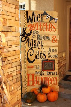 a wooden sign that says when witches go to rain, black cats are here is days until halloween