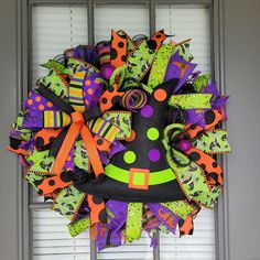 a halloween wreath with witch hats and decorations