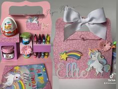 a pink box with unicorns on it and other items