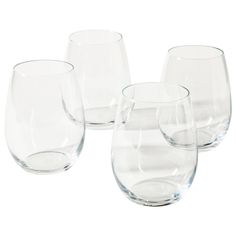 four clear wine glasses sitting next to each other