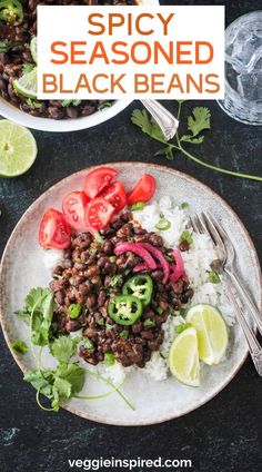 a white plate topped with black beans and rice