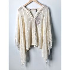 Chelsea & Violet Ivory Lace & Fringe Boho Poncho Nwt - No Flaws Size Xs (Oversized) Ivory Embroidered Lace With Fringe Outline And An Elegant Floral Pattern. V-Neckline Material : 75% Nylon And 25% Cotton Arms Slip Into Dolman Sleeves Handwash And Dry Flat Dry Clean. Offers Welcome! Flowy Cream Blouse For Beach, Flowy Cream Blouse For The Beach, Beige Lace Trim Blouse For Vacation, Cream Lace Tops For Festival, White Lace Blouse For Festival, Summer Bohemian Blouse In Neutral Color, Neutral Bohemian Blouse For Summer, Chic Cream Top For Festival, Summer Bohemian Neutral Blouse