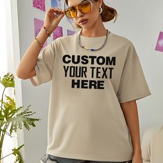 Express your unique style with our 'Custom Your Text Here' T-shirt. Tailor it with your own text, photo, or business logo, making it ideal for personal expressions, team events, or promotional purposes. Perfect for family reunions, corporate events, or special occasions, this custom T-shirt allows you to create a memorable and personalized piece. Celebrate any event with a custom-designed unisex outfit that truly stands out Super Soft & Comfortable: These short sleeve t-shirts are light, comfort White Custom Text T-shirt For Streetwear, Casual T-shirt With Custom Text For Streetwear, Custom Print Crew Neck T-shirt For Customization, Custom Text Basic Crew Neck T-shirt, Custom Text Crew Neck T-shirt For Streetwear, Basic Crew Neck T-shirt With Custom Text, Casual Customizable Letter Print T-shirt, Casual T-shirt With Custom Text For Customization, Casual T-shirt With Custom Text