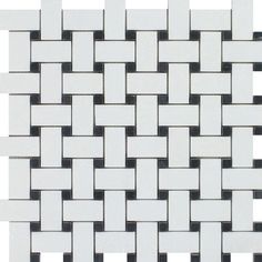 a white and black tile pattern on the wall