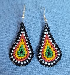 "These cuties are made of 2mm seed beads in a tear drop shape. The hooks are silver toned Hypoallergenic with a clear rubber backing.   The tear drop itself is just about 2\".   I like them!  I made them!  Thanks for stopping by!!" Native Beadwork, Tear Drop Earrings, Fringe Earrings, Tear Drop, Teardrop Earrings, Bead Work, Seed Beads, Jewelry Earrings Dangle, Etsy Earrings