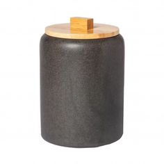 a black jar with a wooden lid on a white background, it appears to be used as a storage container