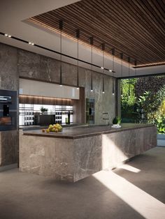 a kitchen with marble counter tops and an island in the middle, surrounded by greenery