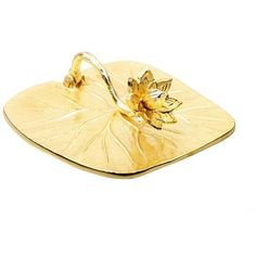 a gold plate with a flower on it