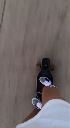 a person with their feet on a skateboard