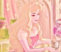 the princess in her pink dress is pouring tea