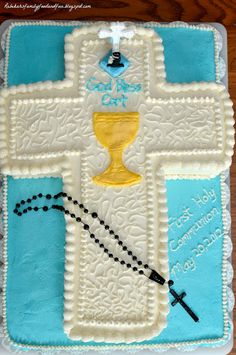 a cake decorated with a cross and a crucifix on the side that says god's cup