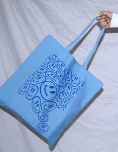 This adorable tote bag features the cutest smiley pattern. It's the perfect go-to reusable tote! PRODUCT DETAILS: -dimensions - 14" x 16" -100% heavy cotton canvas -all designs are created by orijenal Questions?? Please don't hesitate to contact us! Smiley Pattern, Blue Tote Bag, Denim Tote Bags, Blue Tote, Denim Tote, Cute Tote Bags, Tote Bag Purse, Blue Bags, Bags Purses