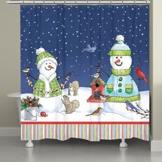 a shower curtain with two snowmen and birds in the snow at night on a snowy day