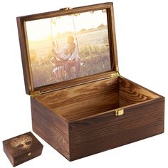 an open wooden box with a photo in it and the lid opened to show a man on a motorcycle