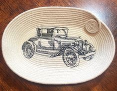 a basket with an antique car drawn on it