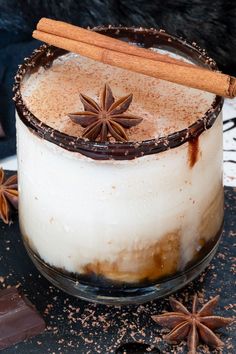 an image of a dessert with cinnamon and star anise