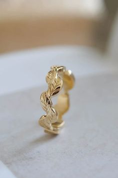 a gold ring sitting on top of a table