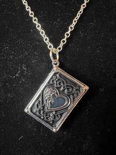 Book heart locket on 18 inch silver plated chain Silver Heart Locket Necklace, Classic Silver Heart Locket Necklace, Silver Heart Pendant Locket Necklace With Vintage Charm, Metal Heart Locket Necklace, Silver Heart Locket Necklace Collectible, Heart-shaped Metal Locket Necklace, Heart-shaped Antique Silver Locket Necklace, Book Locket Necklace, Yule Ball