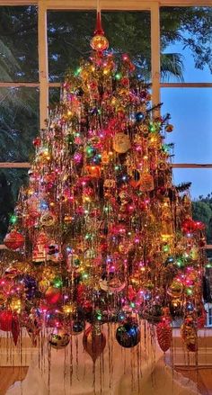 a christmas tree with many ornaments on it