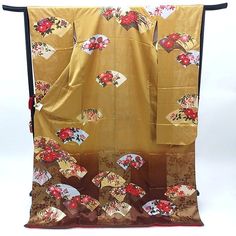 A vintage Japanese Furisode long sleeve kimono in gold. Floral fan design.   Made of high quality silk threads.  Beautiful on or as a room display too. Item: Furisode Silk Kimono frn161 Size: US  XL-XXL   /  Length 71.25 inch (181cm), Width 26 inch (66cm). Design :  Floral fan. Condition: Used, Very Good. Please check the photos. Need a Obi sash to wear this kimono? Find it here: https://www.etsy.com/shop/KimonoFujiyamarock?ref=simple-shop-header-name&listing_id=1418707729&section_id=13757607&so Elegant Gold Kimono For Wedding, Elegant Gold Kimono For Ceremonial Occasions, Traditional Gold Kimono For Wedding, Vintage Long Sleeve Wedding Kimono, Traditional Gold Long Sleeve Kimono, Traditional Long Sleeve Gold Kimono, Traditional Long Gold Kimono, Traditional Yellow Long Sleeve Kimono, Kimono Mom